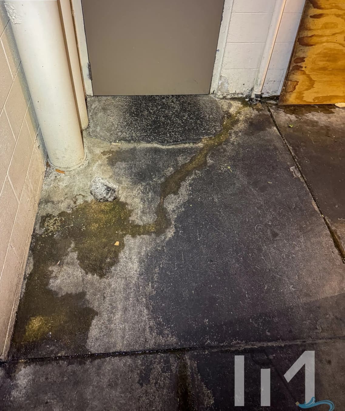 Service entry blackened with grease and algae before cleaning