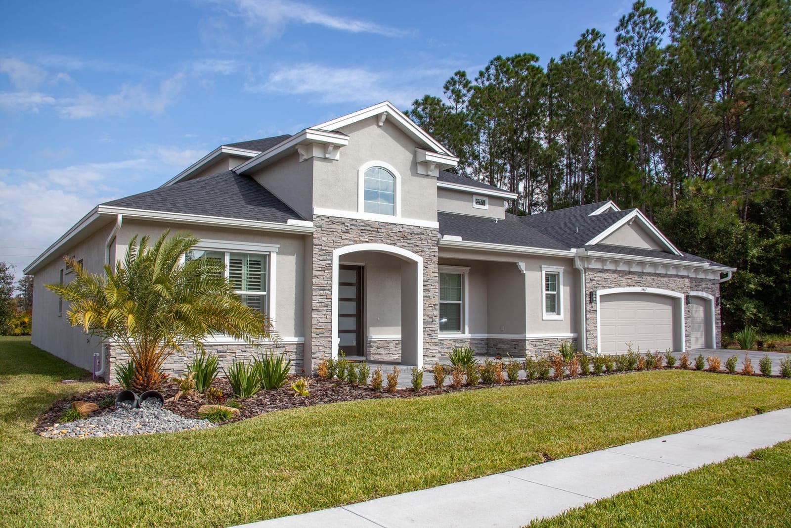The same home with bright, freshly washed concrete